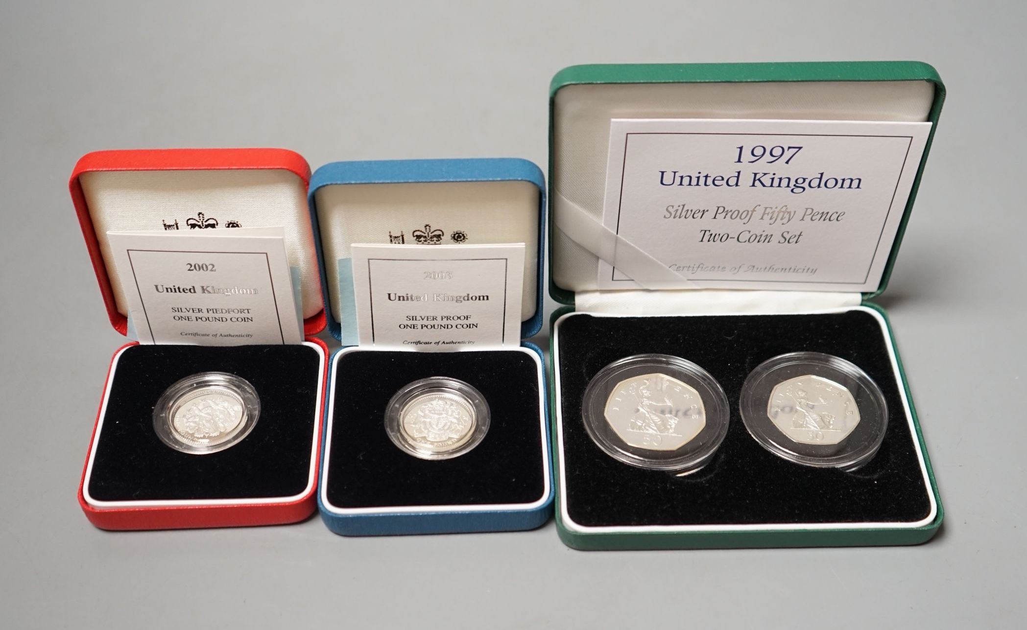 Eight cased Royal Mint proof silver £1 coins for 1997, 2001, 2 x 2002, 2003, 2004 and 2008 & 2009, four cased piedfort proof silver £1 coins for 1999, 2001, 2002, 2005 and five cased Royal Mint proof silver proof 50 penc